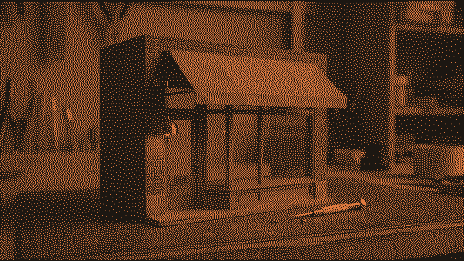 A tabletop model of an old brick storefront with a small new lamp glowing beside the original door, a screwdriver and two screws left on the bench.