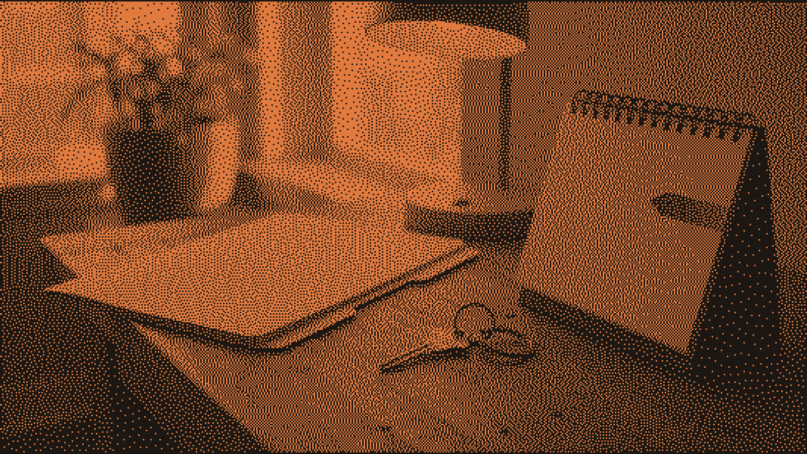 A brass apartment key on a keyring beside a closed blank lease folder and a blank desk calendar with one orange flag, under a warm lamp in a leasing office at late afternoon.
