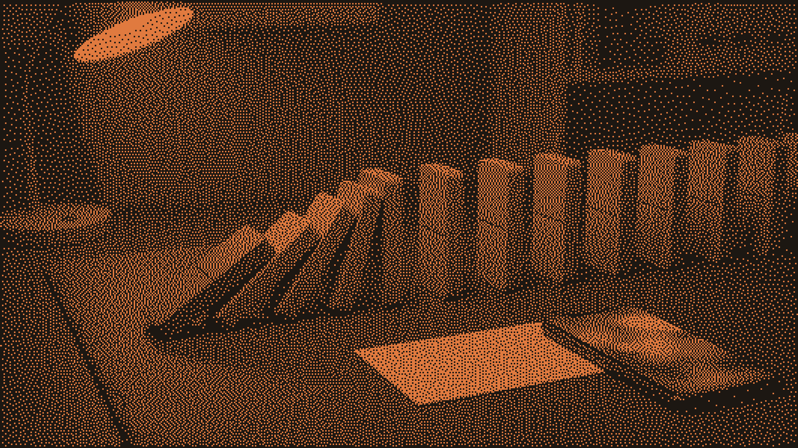 A row of blank grey dominoes on a slate desk caught mid-fall, the first one burnt orange and already tipped, with a blank index card and a softly glowing phone under a desk lamp at night.